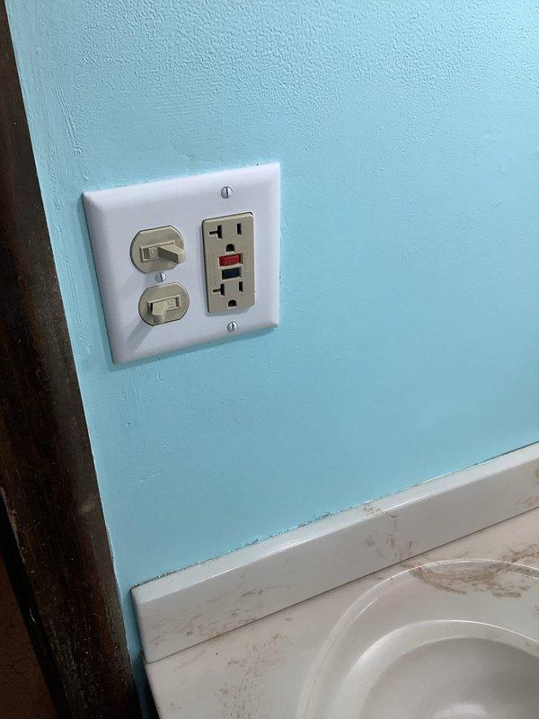 Responded to service call for non-functioning bathroom lighting. Inspected the 50+ year old electrical system and identified faulty wiring connections at the dual toggle switch/GFCI combo plate. Restored proper electrical connections, tested circuit functionality, and verified all pendant lights above vanity mirror now operating correctly. Left installation in safe working order.