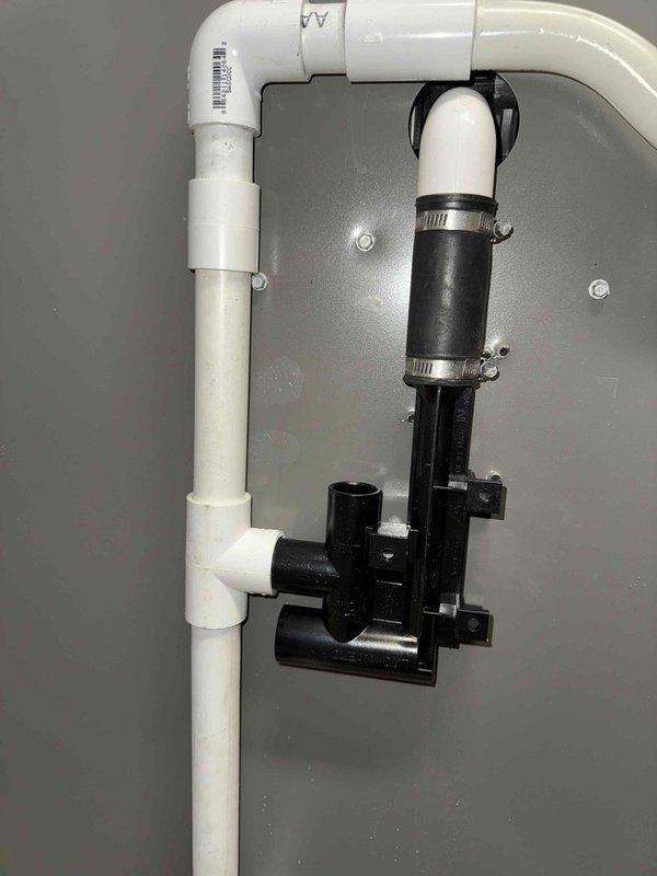 Replaced condensate trap on HVAC system. Installed new PVC drain assembly with proper connections and verified secure mounting to wall. Inspected control board and wiring connections during service to ensure proper system operation.