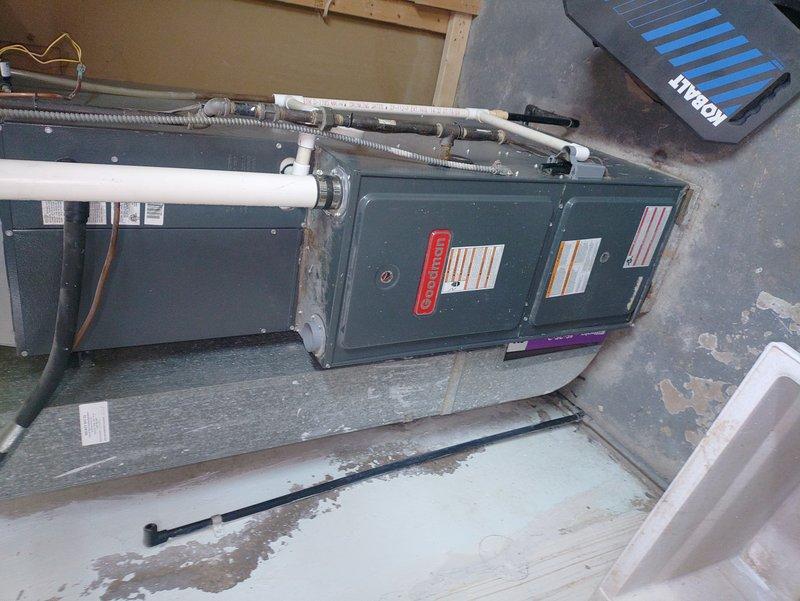 Responded to no heat service call for a Goodman furnace blowing cold air. Diagnostic inspection revealed frost accumulation on the evaporator coil indicating restricted airflow or refrigerant issues. Cleaned condensate drainage system, replaced clogged air filter, and performed system reset which restored proper heating function.