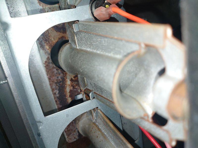 Responded to no heat service call for a Goodman furnace blowing cold air. Diagnostic inspection revealed frost accumulation on the evaporator coil indicating restricted airflow or refrigerant issues. Cleaned condensate drainage system, replaced clogged air filter, and performed system reset which restored proper heating function.