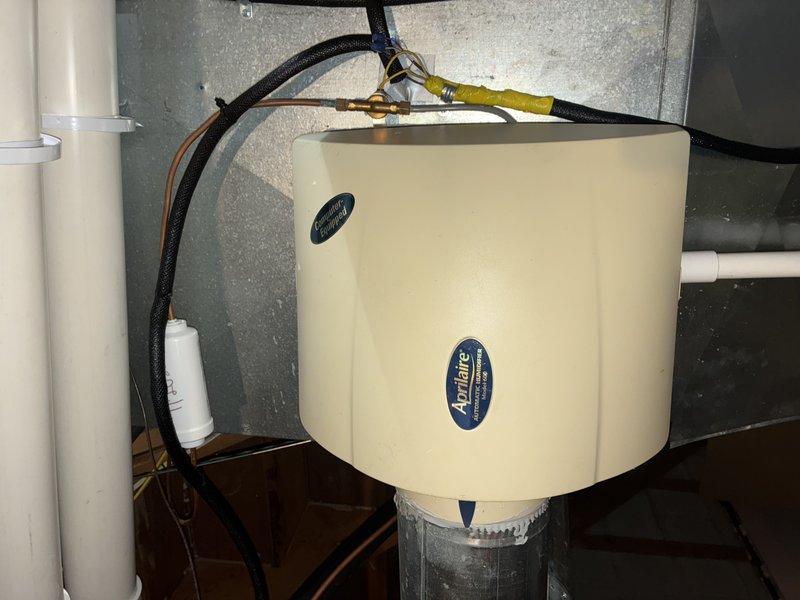 Completed scheduled heating maintenance on 2-year-old system. Inspected Aprilaire humidifier and verified proper installation with all connections secure. Examined ventilation system, including vent grills, confirming adequate airflow with minimal dust accumulation.