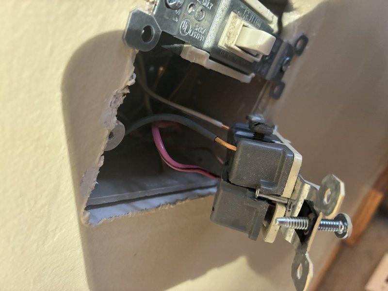 Diagnosed and repaired intermittent kitchen circuit issues causing outlet failures and light flickering. Replaced faulty receptacle with new metal-bracketed outlet box and rewired connections to restore proper electrical function. Shower fixture was inspected but no service was required as it was operating normally.