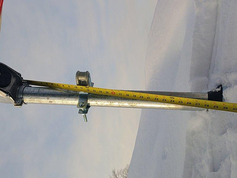 Performed warranty service to address failed inspection. Removed old service entrance conductors and conduit. Extended service mast to required height to ensure proper clearance for service drip loop, and secured/fastened two conduits properly to the side of the panel per code requirements.
