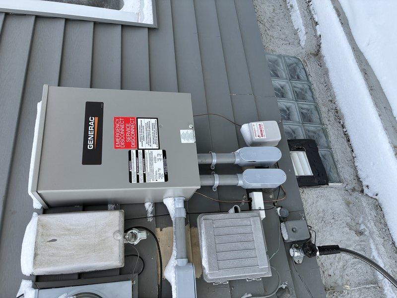 Responded to service call for Generac generator system. Installed transfer switch on exterior wall with proper conduit connections. System was successfully mounted with PVC conduits extending to junction boxes. Customer requires follow-up visit for operational training as previously promised by technician.