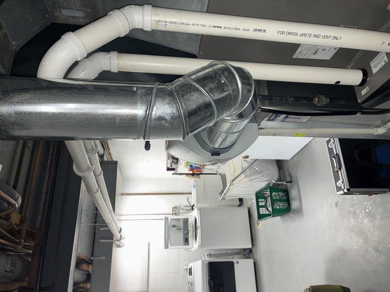 Performed scheduled MVP heating maintenance service. Inspected utility room HVAC system including ventilation components and ductwork connections, confirming proper installation with no visible damage. Examined and verified functionality of plumbing valves, including quarter-turn ball valve with blue handle connected to copper piping.