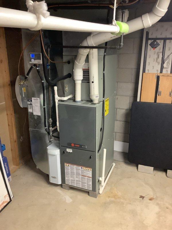 Successfully completed installation of a 90% efficiency furnace with proper ventilation system setup. Installed PVC exhaust/intake piping with appropriate insulation at connection points. Mounted control panel on adjacent wall and ensured all components were properly secured and operational.