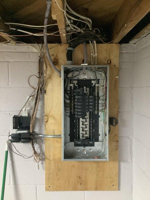 Completed 100A service upgrade with installation of exterior disconnect to comply with 2023 National Electrical Code requirements. Updated grounding system and refed existing sub panel with SER cable. Work performed by two-person team over 8-hour period.
