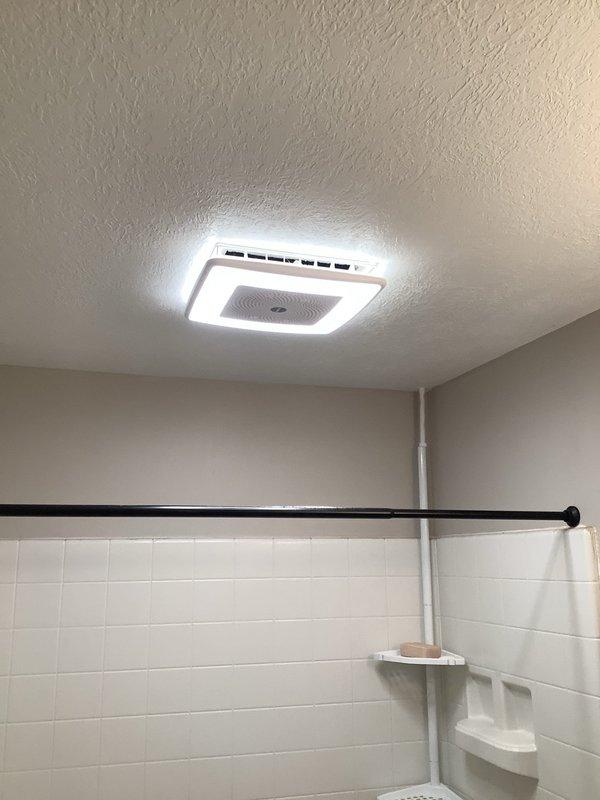 Successfully installed two customer-provided bathroom exhaust fans with proper venting, one vented to the exterior and one with repaired existing ventilation. Installed range hood above oven with power connected to the light switch circuit, and added a GFCI-protected exterior outlet on the front facade of the residence.