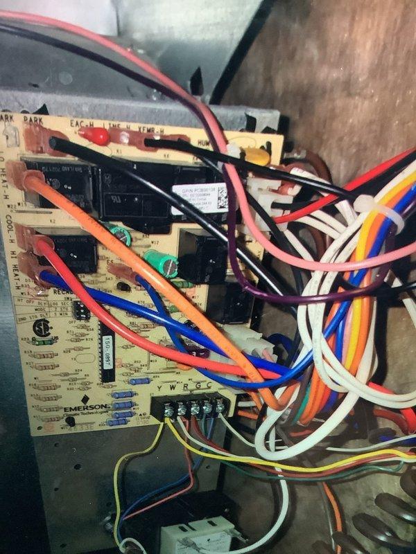 Performed routine tune-up on aging furnace (10+ years). Inspected control board connections and verified proper wiring integrity on Emerson circuit board. Examined and cleaned heat exchanger fins which showed normal dust accumulation and wear consistent with equipment age. All systems functioning within acceptable parameters.