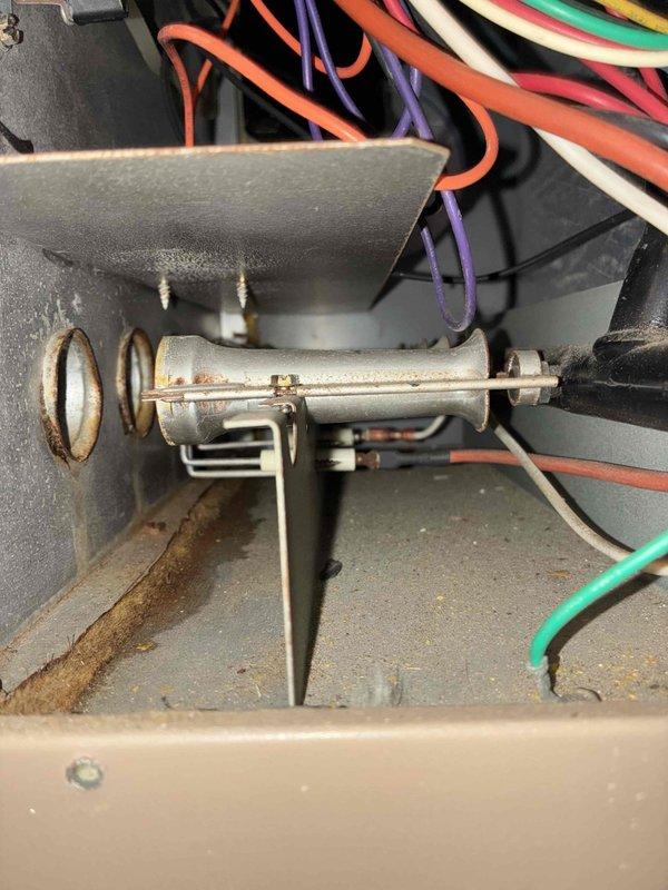 Performed scheduled furnace tune-up service. Inspected and verified proper installation of air filtration system (16.25.1 filter). Examined internal wiring connections and valve assembly, noting minor corrosion on metal components. System is operational with recommended maintenance completed.