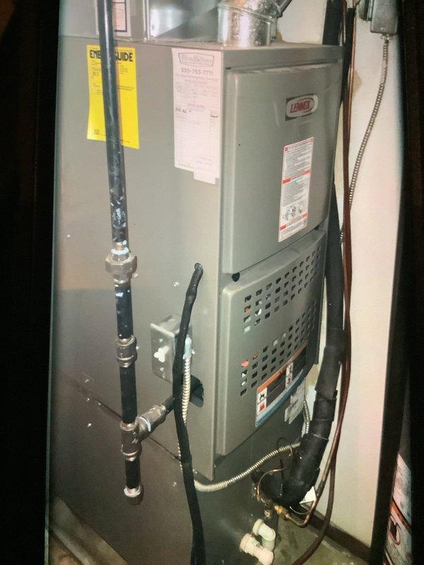 Performed scheduled maintenance on a Lennox furnace of unknown age. Inspected unit components, connections, and ductwork for proper operation. Used hex key tool to make necessary adjustments to ensure optimal heating system performance.