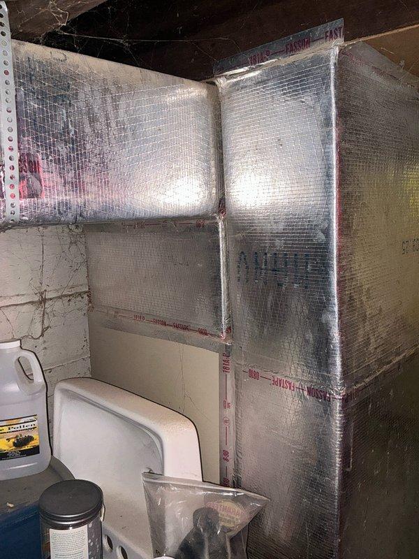 Conducted evaluation of 37-year-old Lennox PULSE furnace in basement for potential replacement. System shows significant age-related wear with compromised ductwork connections. Basement has DIY foil-faced insulation panels installed throughout. Recommended full system replacement due to equipment age, efficiency concerns, and potential safety issues with this older pulse combustion model.