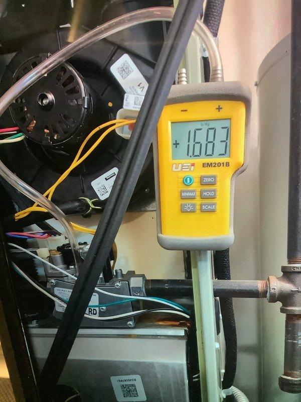 Performed annual furnace maintenance service on 10-year-old unit. Conducted amperage testing on blower motor with readings of 16.03 amps. Observed frost accumulation on evaporator coils and signs of corrosion on the condensate pan, which were documented with photos for future reference.