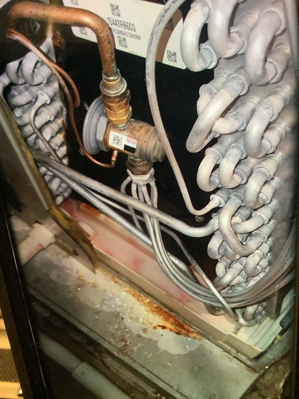 Performed annual furnace maintenance service on 10-year-old unit. Conducted amperage testing on blower motor with readings of 16.03 amps. Observed frost accumulation on evaporator coils and signs of corrosion on the condensate pan, which were documented with photos for future reference.