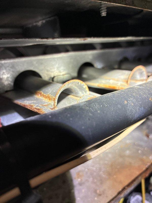 Performed scheduled MVP maintenance service on furnace. Inspected internal components with hex tool and identified rust formation on heat exchanger and metal components, indicating moisture exposure and potential corrosion issues. Will need to monitor rust development on curved metal elements of the heating system.