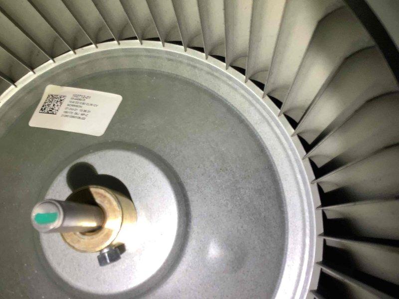 Performed routine maintenance on furnace system. Inspected blower wheel assembly, confirming proper condition of fan blades and central shaft components. Verified blower wheel operation with no signs of dust accumulation or mechanical wear.