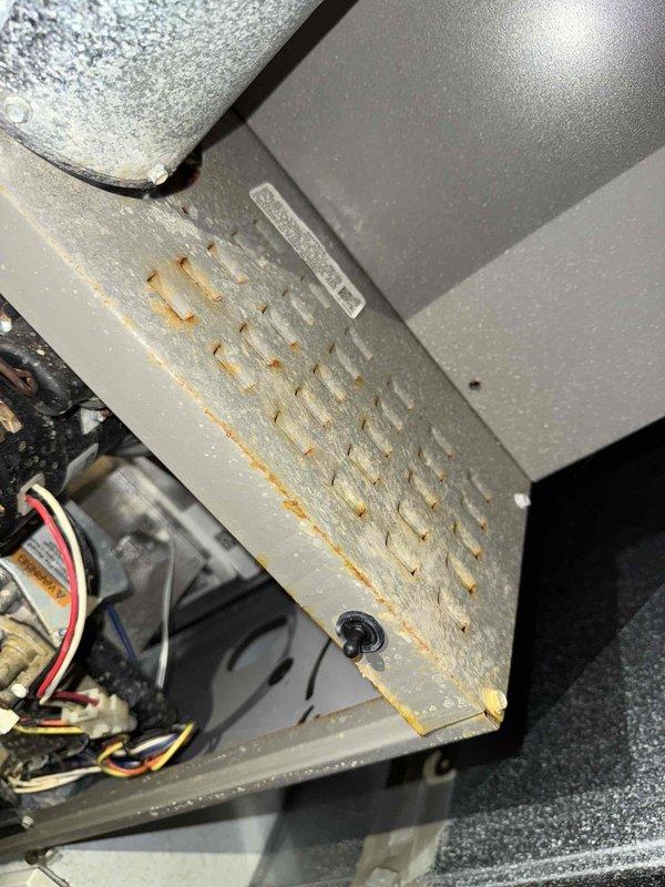 Diagnosed 5-year-old gas furnace that was non-operational. Inspection revealed significant rust and corrosion on the heat exchanger along with a failing control board connected to the blower motor. Replaced damaged components to restore proper system functionality.
