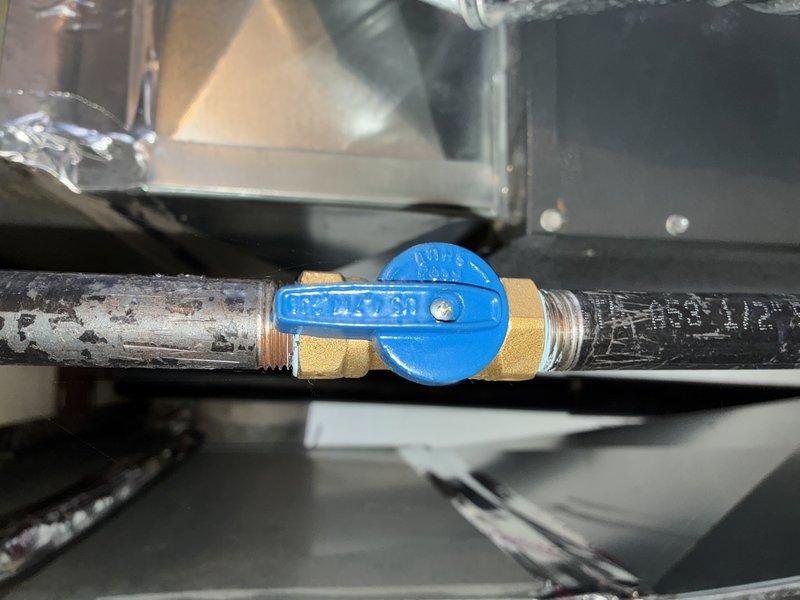Completed MVP Heating Visit on 2-year-old system. Inspected valve assembly showing minor corrosion on connecting pipes and examined ventilation louvers which displayed normal dust accumulation. System appears to be in functional condition despite visible wear on components.