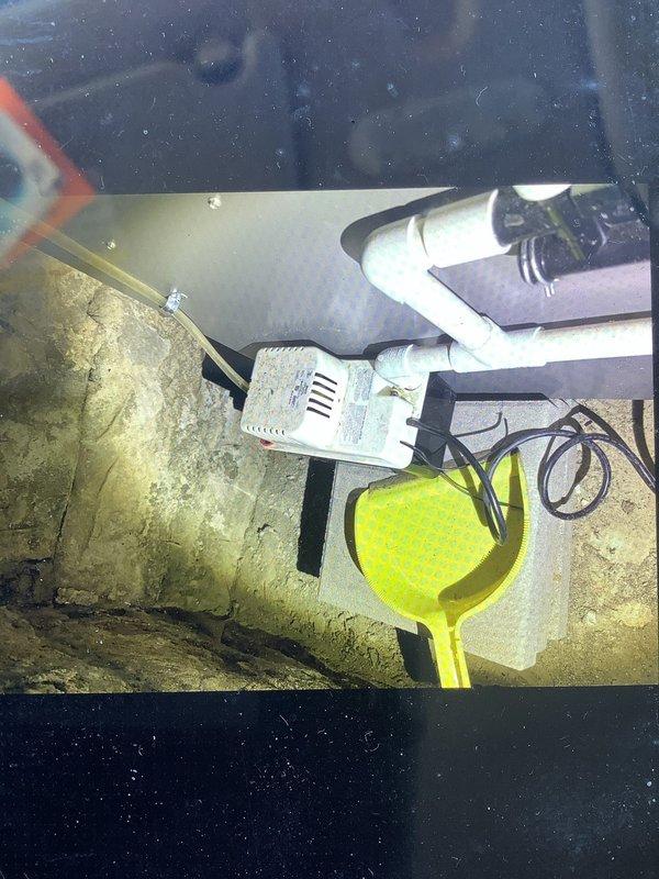 Responded to service call for furnace issue. Discovered condensate pump had become dislodged from its mounting position. Accessed crawl space/basement area, inspected PVC drain lines and associated plumbing connections, and properly secured the condensate pump to prevent future displacement.