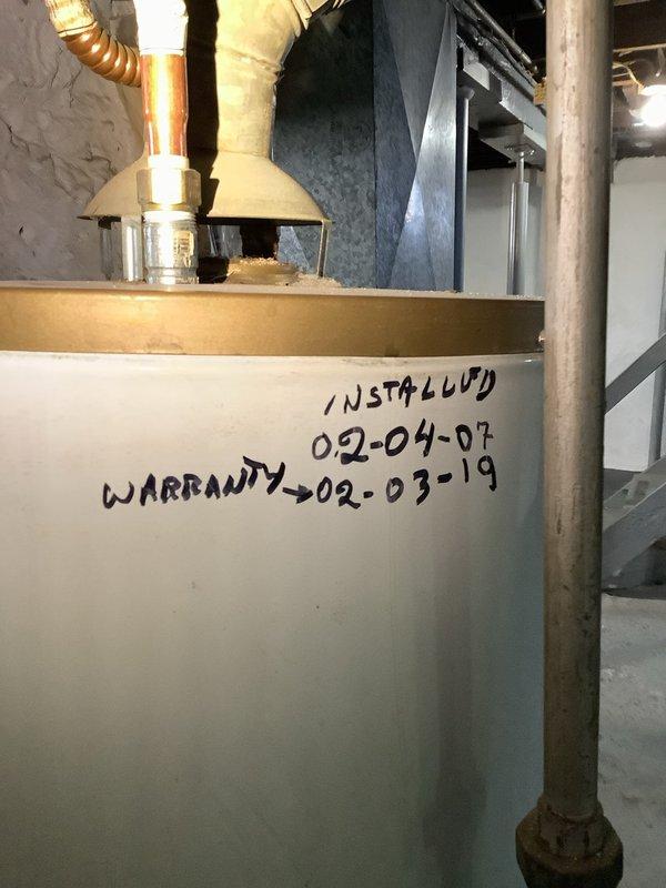 Responded to service call for leaking water heater with insufficient hot water. Diagnosed 16-year-old unit (installed 02-04-07) with significant corrosion at connection points and expired warranty. Replaced tank, fittings, and connected new unit to existing copper piping system.