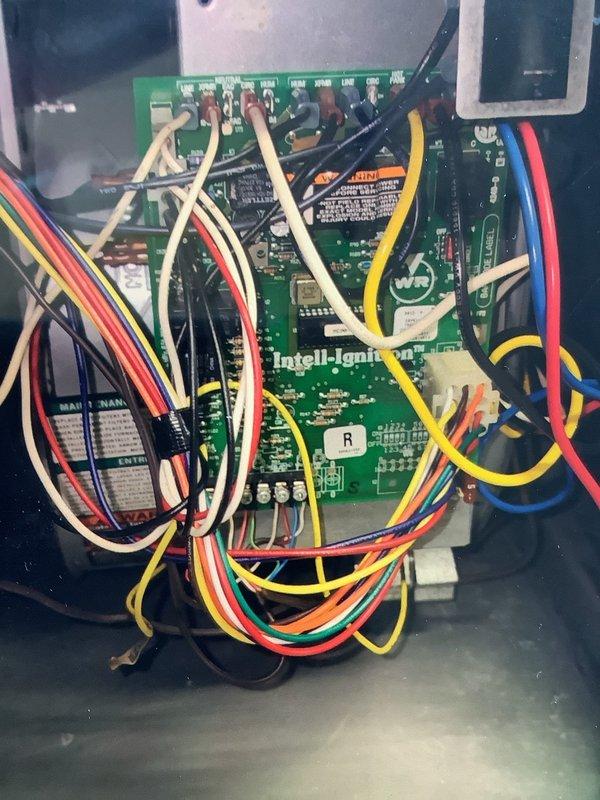 Performed comprehensive furnace tune-up including inspection of the flame sensor and verification of proper ignition system functionality. Examined the Intell-Ignition control board and associated wiring connections to ensure all electrical components were operating within specifications. System is now functioning correctly with all safety features verified.