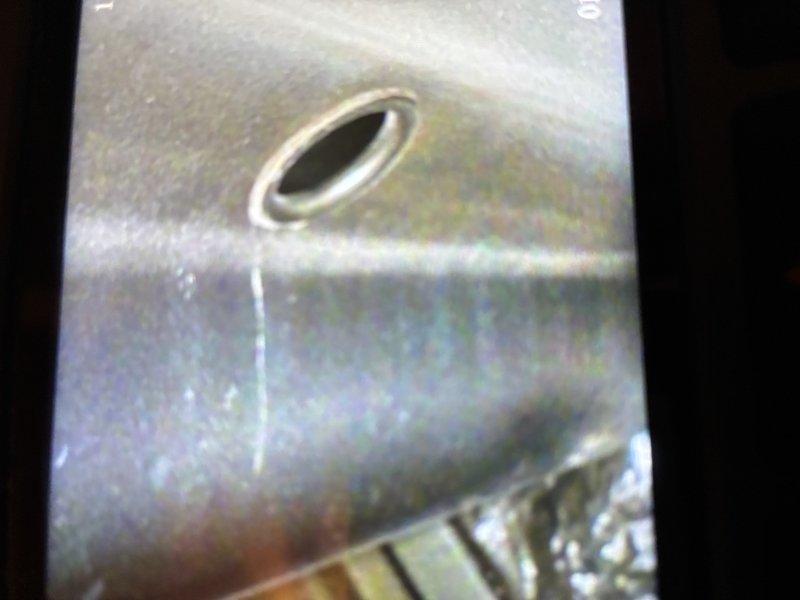 Completed scheduled maintenance visit on 20-year-old heating system. Inspected blower motor assembly which showed signs of normal operational wear. Examined and cleaned ventilation components including access panel. System functioning adequately despite age, recommended continued regular maintenance.