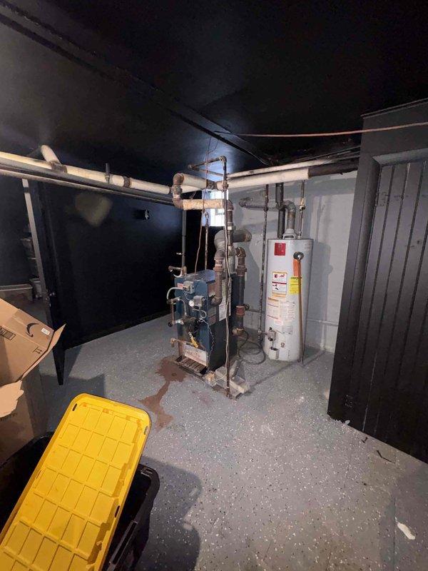 Conducted assessment for mini-split system installation and potential furnace replacement in home currently heated by aging steam boiler system. Evaluated existing utility room configuration, documented current heating equipment condition, and determined that new ductwork will be required for furnace option. Presented multiple heating system replacement options to homeowner Matt H.