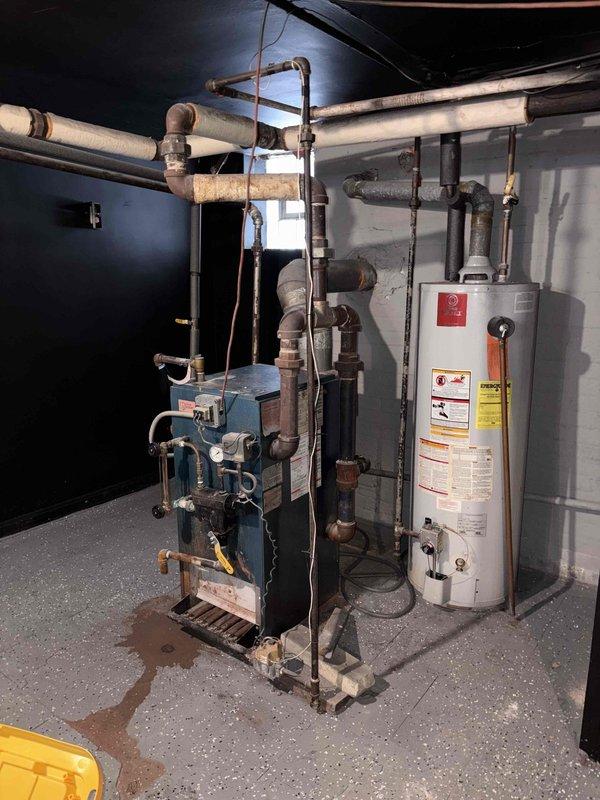 Conducted assessment for mini-split system installation and potential furnace replacement in home currently heated by aging steam boiler system. Evaluated existing utility room configuration, documented current heating equipment condition, and determined that new ductwork will be required for furnace option. Presented multiple heating system replacement options to homeowner Matt H.