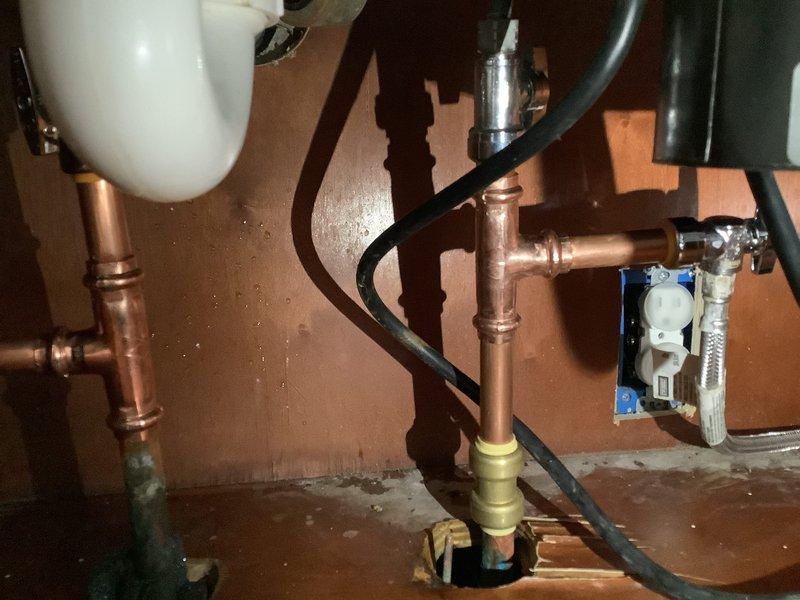 Completed replacement of ice maker shutoff valve as requested, along with installation of new shutoff valves for kitchen faucet and hot water line. All copper connections properly fitted and tested for leaks, with new brass fittings secured to ensure proper water flow and prevent future leakage issues.