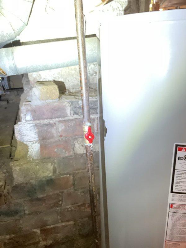 Successfully replaced a leaking 2017 30-gallon gas water heater with a new Bradford White 40-gallon short model featuring a 6-year manufacturer warranty. Installation included new ball valve, thermal expansion tank, gas shut-off valve, copper drip leg, and conversion from flexible water lines to hard-piped connections, along with removal of corroded secondary shut-off valve on hot water vertical line with complete rebuild from that point.