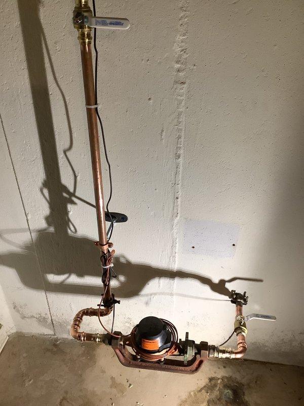 Successfully replaced the corroded main water valve by removing the old leaking gate valve and installing a new 3/4" ball valve with necessary piping and fittings. Installed a secondary valve on the riser and replaced the customer-supplied inline filter before the meter, addressing the water leakage issue evident from staining on the concrete floor.