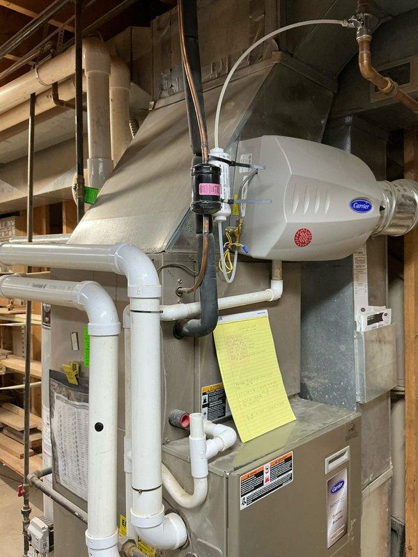 Conducted assessment on 16-year-old furnace with malfunctioning draft inducer motor causing vibration issues. Determined replacement necessary due to age of system and potential for complete failure. Recommended and installed new Carrier furnace with properly configured condensate drainage system including P-trap assembly and appropriate PVC venting.