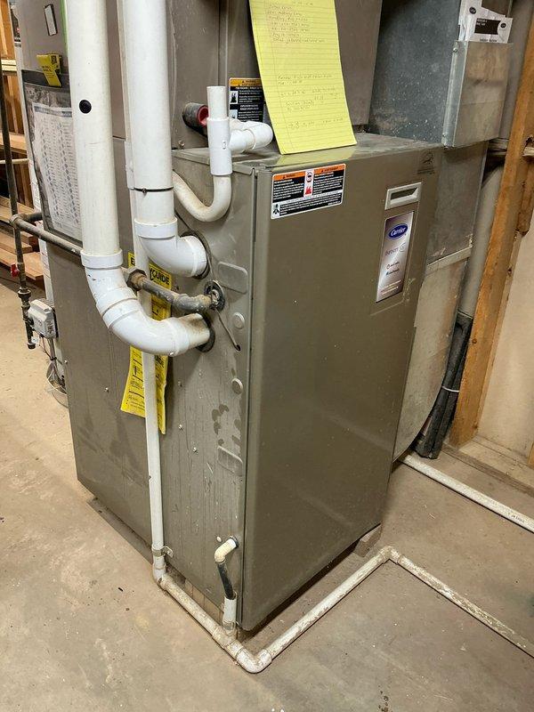 Conducted assessment on 16-year-old furnace with malfunctioning draft inducer motor causing vibration issues. Determined replacement necessary due to age of system and potential for complete failure. Recommended and installed new Carrier furnace with properly configured condensate drainage system including P-trap assembly and appropriate PVC venting.