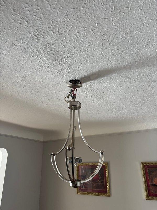 Performed comprehensive electrical service on residential fixtures. Installed new chandelier-style ceiling fixture with proper wiring connections. Replaced malfunctioning doorbell box, ensuring secure mounting and correct terminal connections to restore functionality.