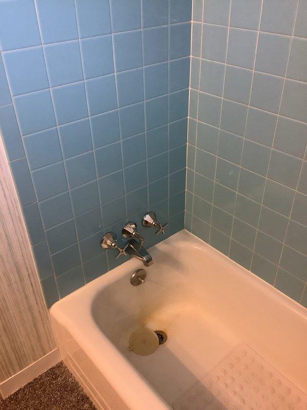 Repaired two leaky faucets in customer's 67-year-old home by replacing worn washers. Fixed malfunctioning bathtub drain stopper mechanism, restoring proper functionality. Inspected copper plumbing infrastructure behind access panel to verify no additional leaks were present in the system.