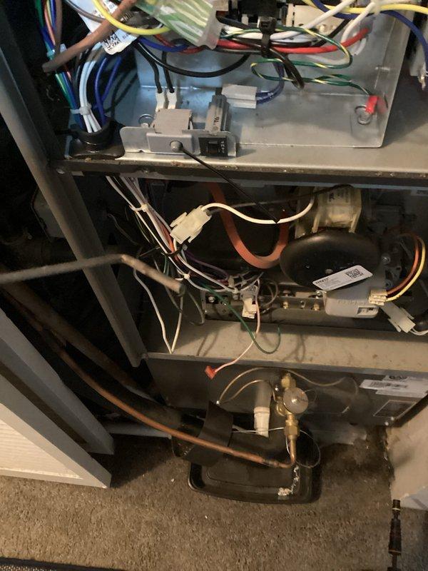 Responded to no-heat call for 3-year-old furnace (MVP 2025). Diagnosed electrical issue affecting ignition sequence. Inspected interior components including Resideo motor and wiring connections. Observed blue flame indication at burners after repair, confirming proper ignition restored. System now heating correctly with all safety functions operational.