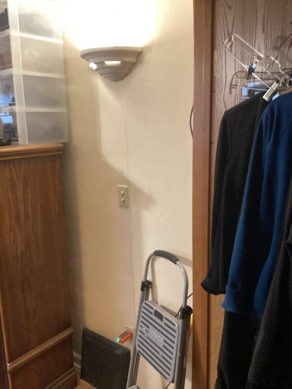 Responded to service request for a previously replaced wall light fixture and non-functional ceiling fan. Inspected electrical panel to verify circuit integrity. Repaired loose connection at wall sconce which restored proper operation. Ceiling fan issue traced to faulty pull-chain switch; replaced switch assembly and confirmed full functionality of both lighting fixtures.