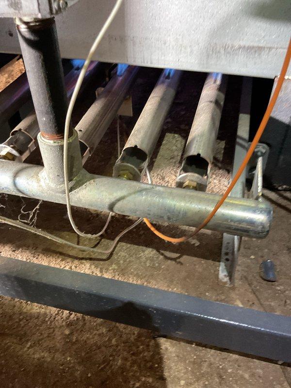 Responded to no heat call for Weil-McLain furnace. Upon inspection, found faulty ignition system with damaged electrodes and pilot assembly. Cleaned corroded connections, replaced ignition electrode, and restored proper flame sensing. System now operating with normal heat output.