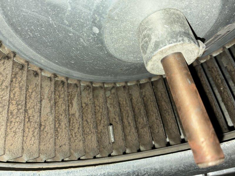 Performed scheduled maintenance on 17-year-old heating system. Inspected heat exchanger and burner assembly, noting dust accumulation on fins and mechanical components. Conducted combustion analysis with readings at 0.99, confirming system operation within acceptable parameters despite age-related wear.