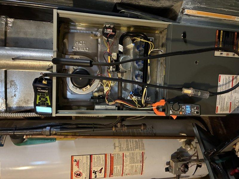 Performed scheduled maintenance on 17-year-old heating system. Inspected heat exchanger and burner assembly, noting dust accumulation on fins and mechanical components. Conducted combustion analysis with readings at 0.99, confirming system operation within acceptable parameters despite age-related wear.