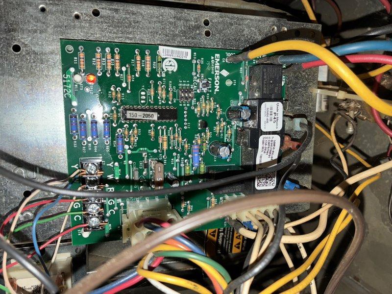 Performed comprehensive furnace tune-up on aging unit. Inspected and cleaned internal components including blower motor assembly and heat exchanger which showed normal dust accumulation. Examined Emerson control board and electrical connections for proper functionality; all wiring and terminals were secure with no signs of damage or corrosion.