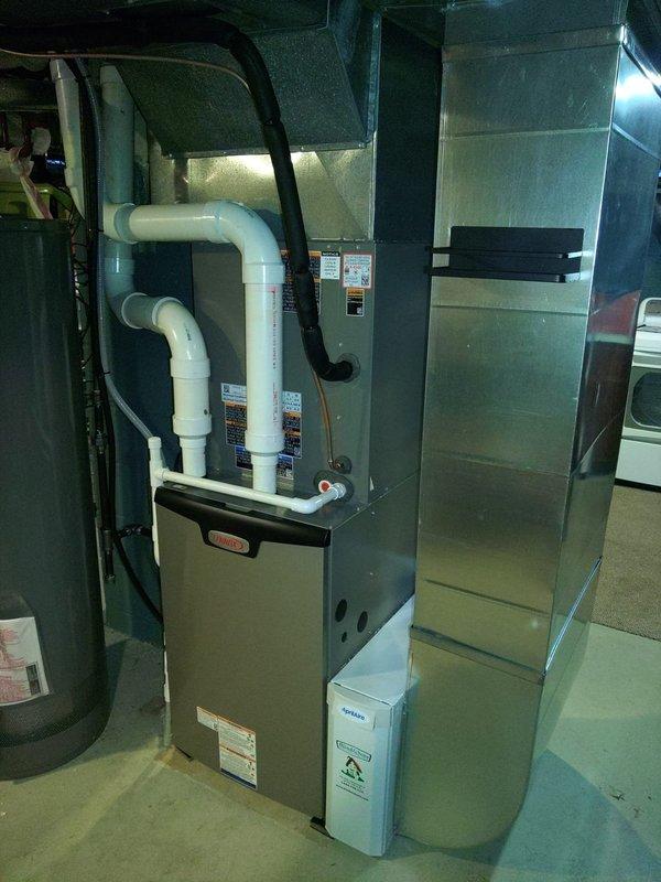 Completed installation of a new 90% efficient Furnace (FRN) and Air Conditioning system in customer's basement. Installation included proper venting with PVC pipes, connection to existing ductwork, and drainage setup with condensate removal system. All components were properly secured and tested for optimal performance.