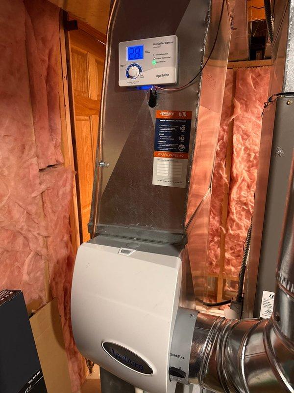 Successfully installed an Aprilaire 600 whole-home humidifier and air scrubber system to improve indoor air quality. The humidifier was properly mounted to existing ductwork with all necessary electrical connections made to the control panel. Both units were tested for proper operation with humidity levels verified on the digital display.