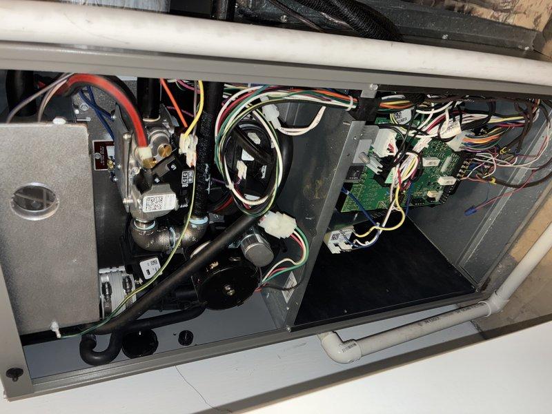 Performed scheduled fall maintenance on 6-year-old furnace. Inspected control board and electrical connections, confirming proper wire connections to circuit board terminals. Examined internal components including fan assembly and drainage system, all found in good working condition with no visible issues.