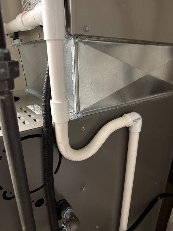 Successfully installed 80% furnace with 2410 configuration on bottom. Repositioned evaporator coil for improved service access and connected drainage system with PVC piping. Installed new carbon monoxide detector for safety compliance.