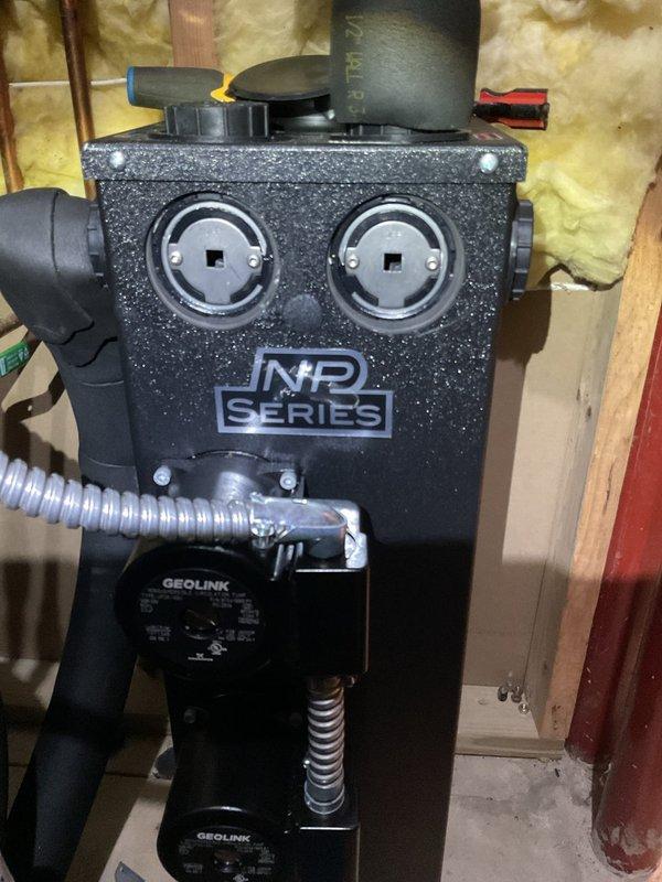 Replaced failed circulating pump on WaterFurnace geothermal system. Installation included removing old GEOLINK pump component and installing new warranty replacement unit. System now operating properly with restored circulation through the NP Series assembly.
