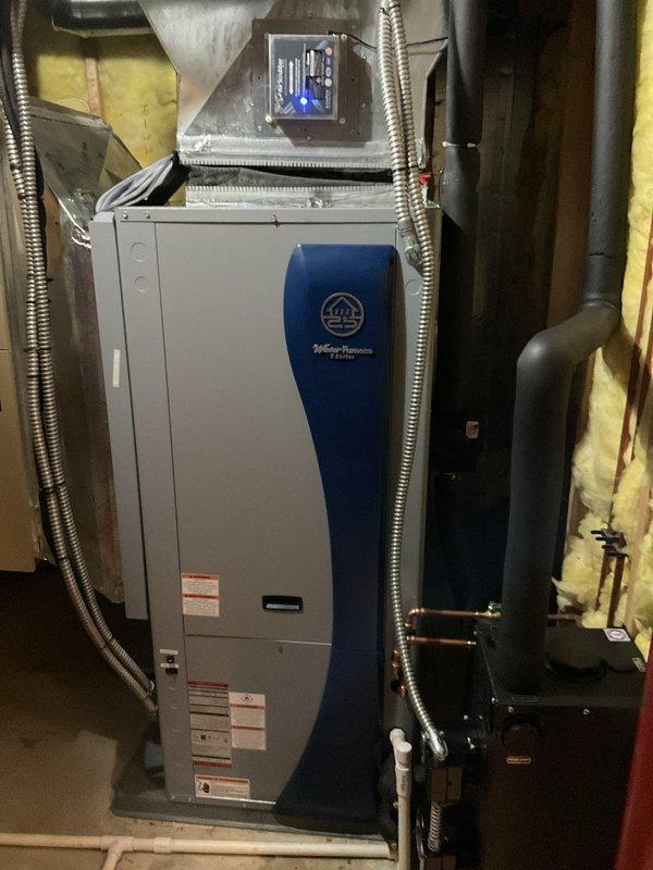 Replaced failed circulating pump on WaterFurnace geothermal system. Installation included removing old GEOLINK pump component and installing new warranty replacement unit. System now operating properly with restored circulation through the NP Series assembly.
