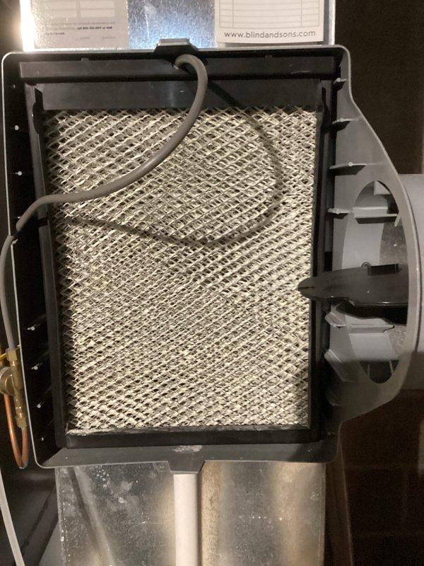 Performed scheduled MVP Heating maintenance service on 2-year-old Lennox furnace system with attached Aprilaire humidifier and air purifier. Inspected complete system setup including ventilation, drainage components, and electrical connections. Removed, inspected, and cleaned the air filter which showed normal accumulation of airborne particles, then reinstalled and confirmed proper system operation.