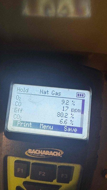 Completed scheduled MVP Heating maintenance service. Performed combustion analysis on natural gas furnace using Bacharach analyzer, confirming proper operation with 80.2% efficiency, CO levels at 17ppm, and appropriate O2/CO2 readings (9.2%/6.6%). Inspected draft inducer motor assembly and control components, verifying all electrical connections and wiring harnesses were secure and in good condition.