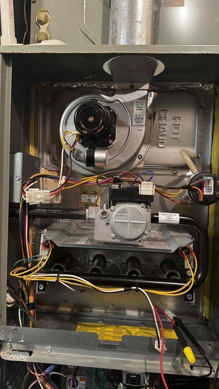 Completed scheduled MVP Heating maintenance service. Performed combustion analysis on natural gas furnace using Bacharach analyzer, confirming proper operation with 80.2% efficiency, CO levels at 17ppm, and appropriate O2/CO2 readings (9.2%/6.6%). Inspected draft inducer motor assembly and control components, verifying all electrical connections and wiring harnesses were secure and in good condition.